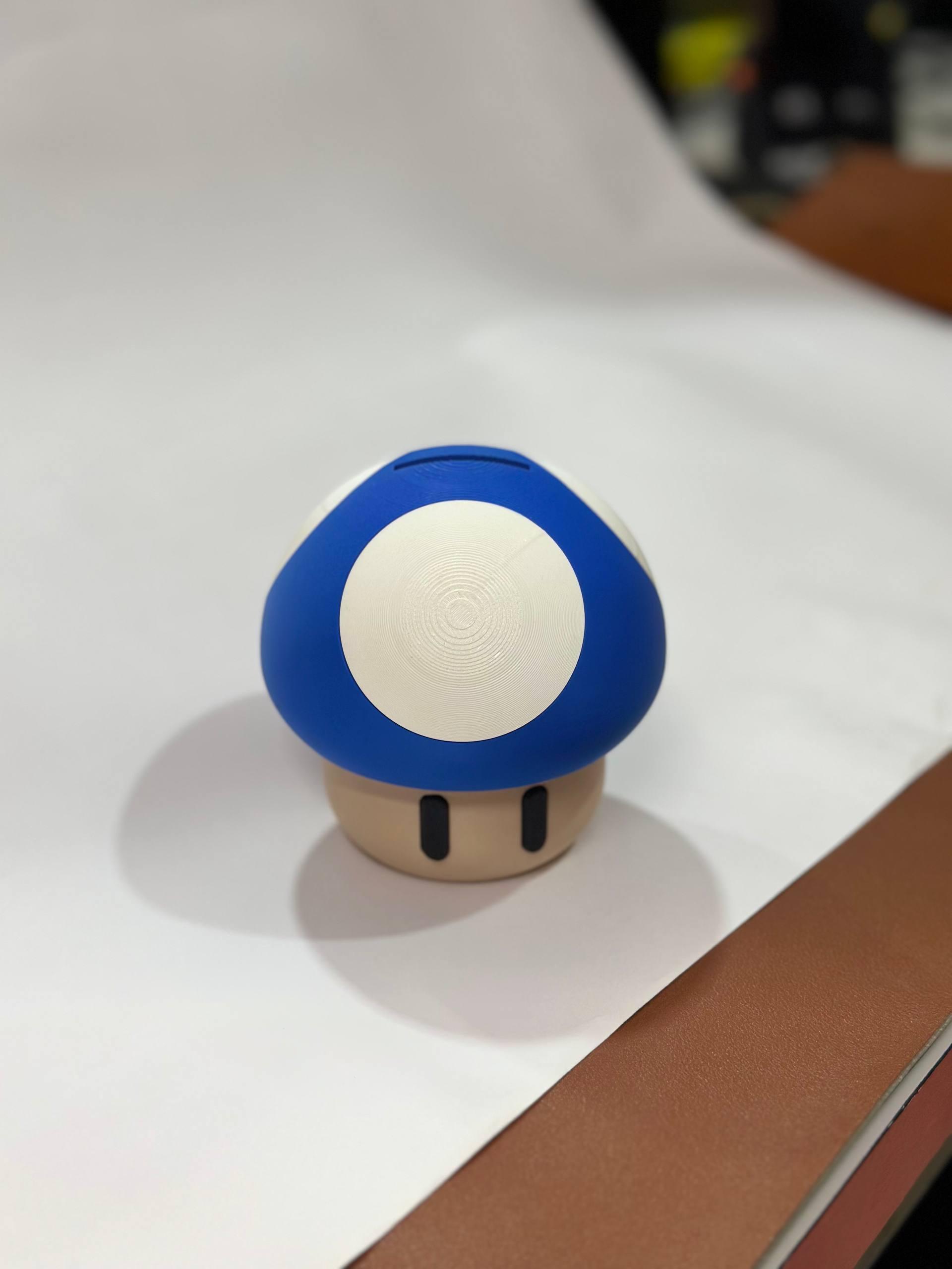 3D printed magic mushroom coin bank in red — fan-inspired piggy bank desk decor by LayerPop