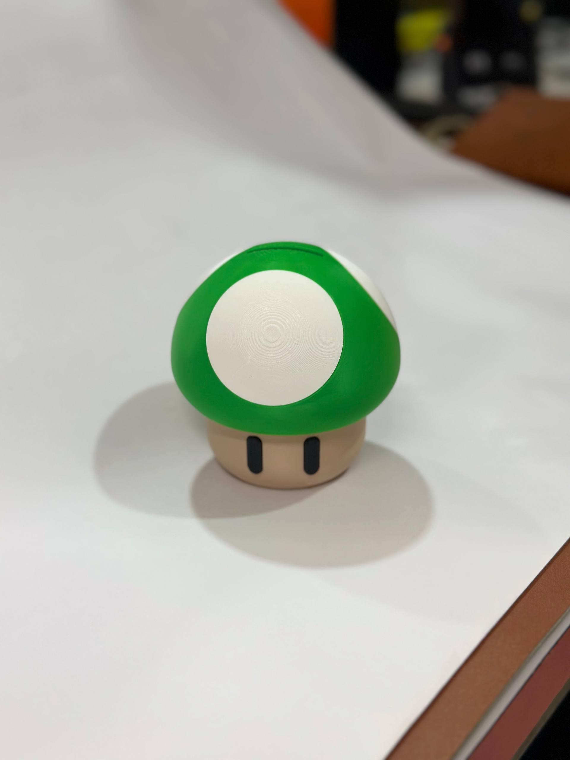 3D printed magic mushroom coin bank in red — fan-inspired piggy bank desk decor by LayerPop