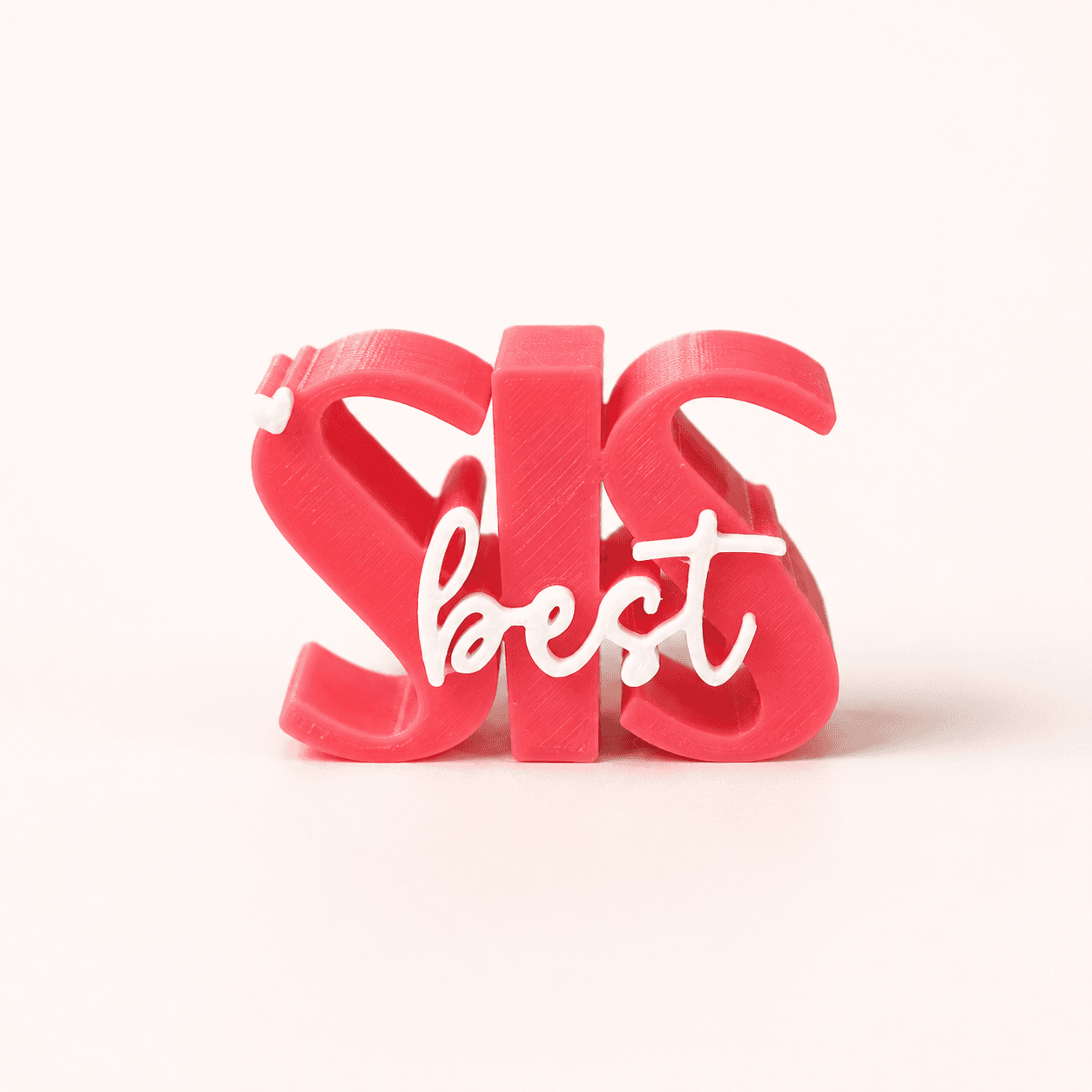3D printed Best Sis desk prop in pink — sister gift and desk keepsake by LayerPop