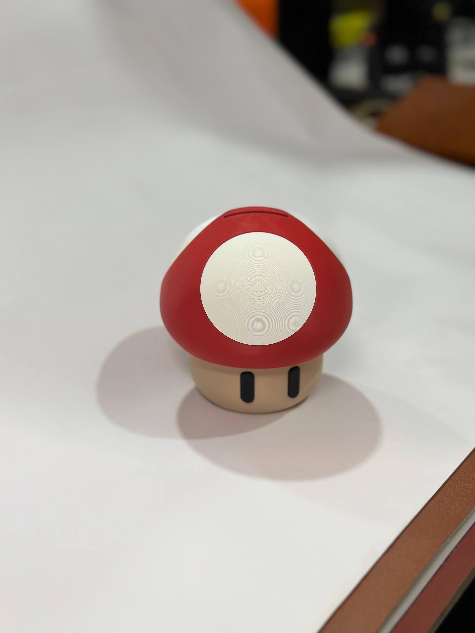 3D printed magic mushroom coin bank in red — fan-inspired piggy bank desk decor by LayerPop
